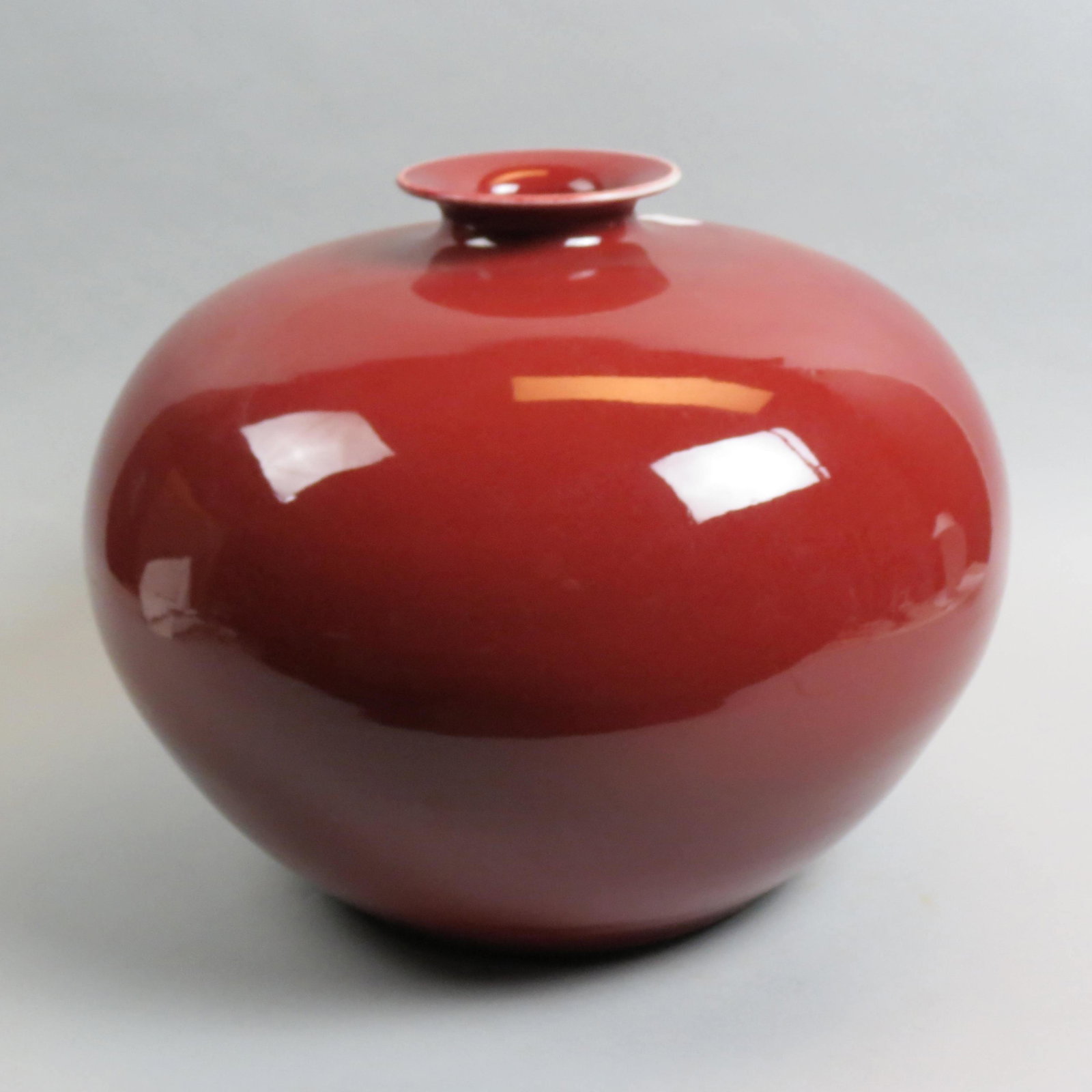 Chinese Sang de Boeuf Porcelain Vase,: squat bulbous body with thin neck, 18" diameter, 14" tall, excellent..........Definition of sang de boeuf1: an opaque claret red to brownish red reduced copper glaze developed in China during the K