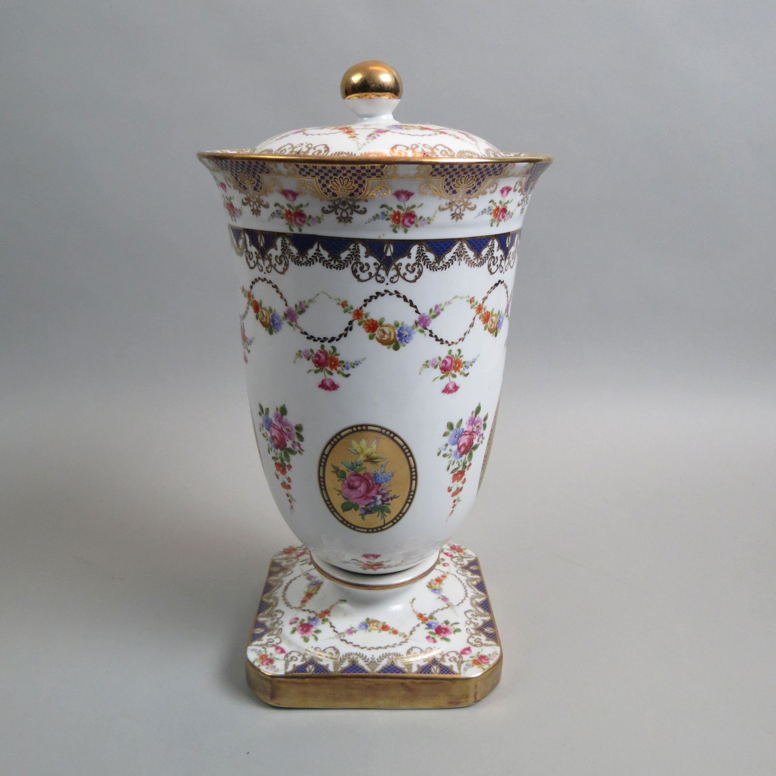 Limoges Porcelain Large Covered Urn,: floral medallion, floral sprays and garland, blue and gold trim, 14 1/2" tall, excellent.