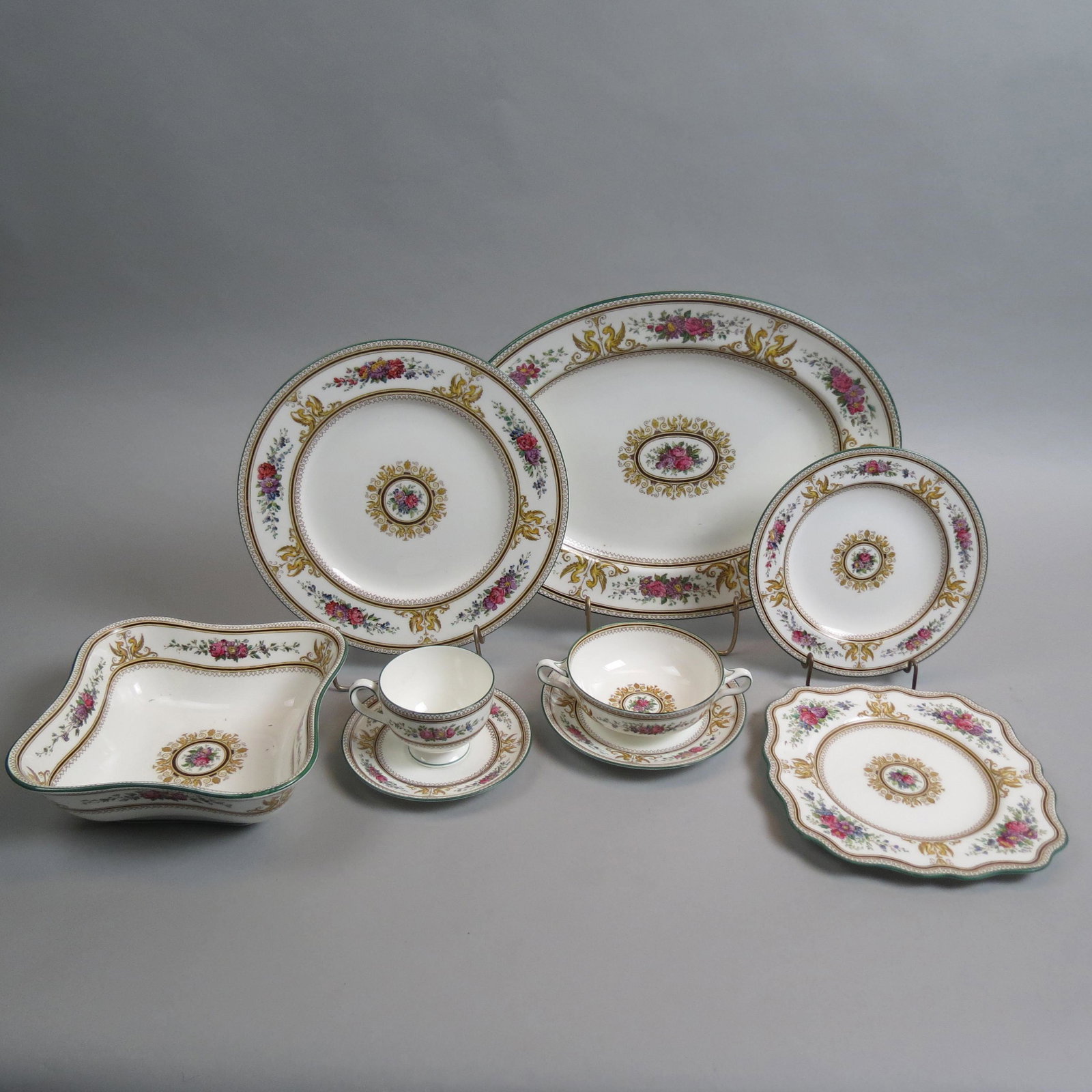 100 pc. Wedgwood "Columbia" China Service,: pattern W-595, includes 14 dinner plates, 11 salad plates, 13 square dessert or luncheon 8" plates, 8 bread and butter plates, 14 cups, 14 saucers, 12 cream soups, 12 soup saucers, an oval platter 15"