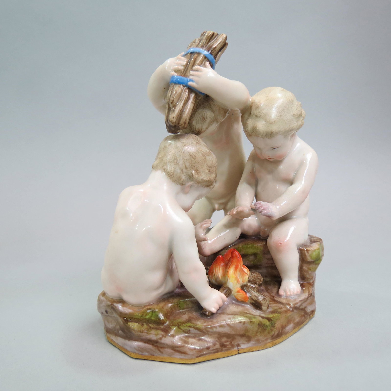 Meissen Porcelain Figurine of Three Putti,: building a fire, 5 1/2", A-5, crossed swords mark, excellent.