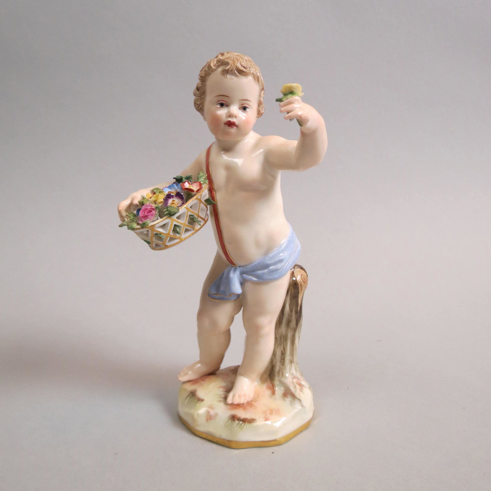 Meissen Porcelain Figurine of Boy with Flowers,: yellow rose in left hand, basket of flowers in right, lilac cloth upon shoulder, #131, A-64, 5", crossed swords mark, excellent.