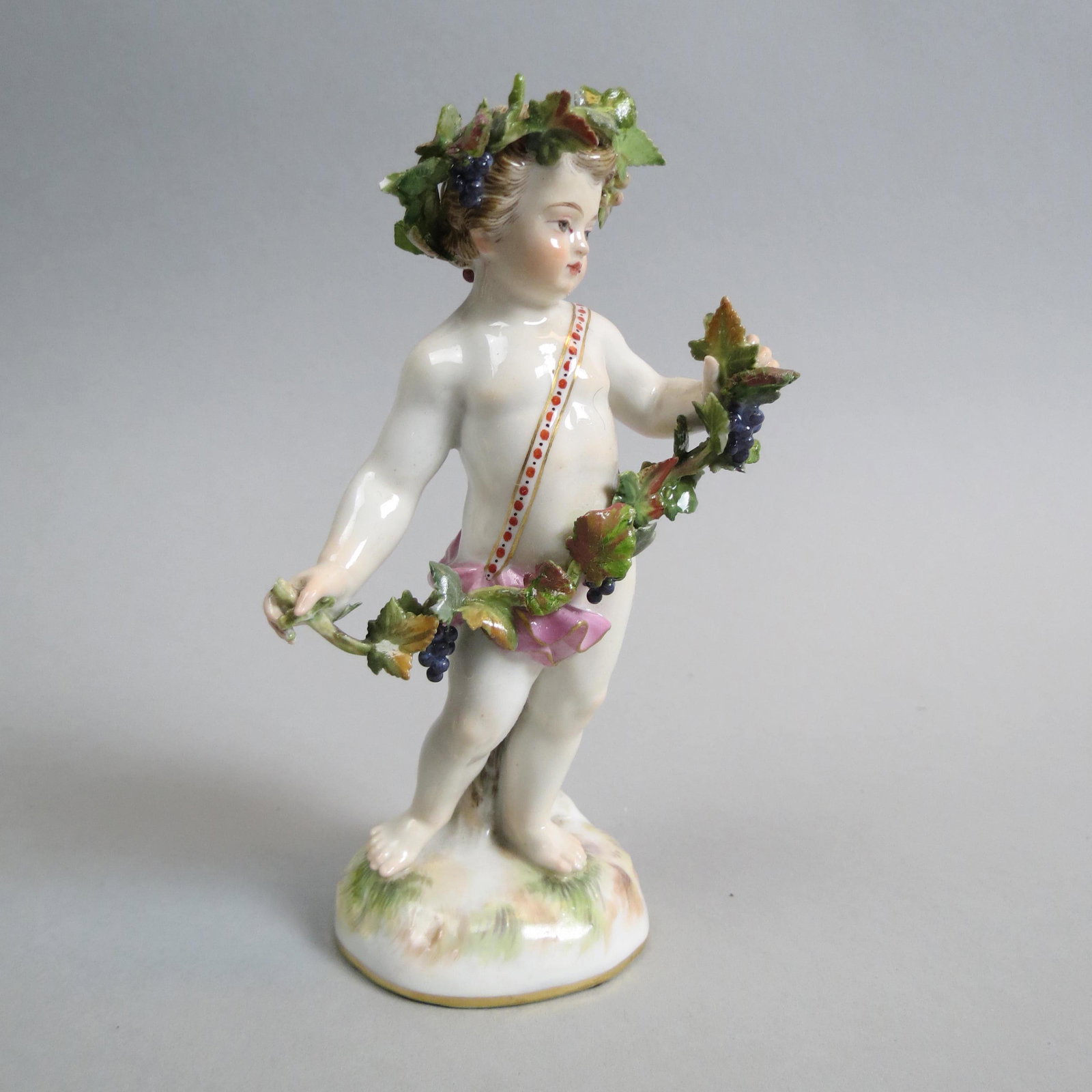 Meissen Porcelain Figurine of Child & Grapevine,: 5", A-69, minor loss noted, crossed swords mark.