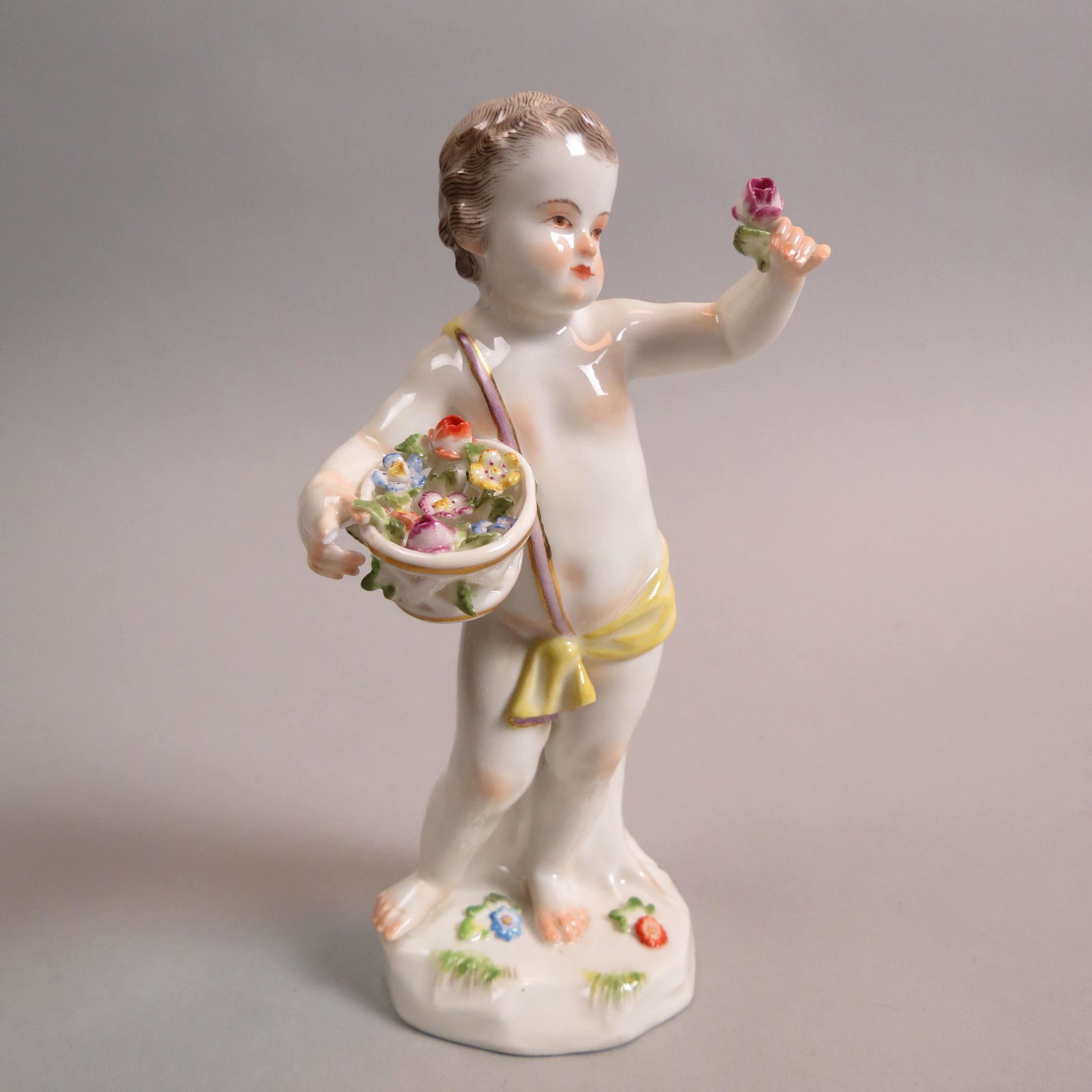 Meissen Porcelain Figurine of Boy with Flowers,: basket in right hand, single flower in left, yellow cloth, A-64, 5 1/4", crossed swords mark, excellent.