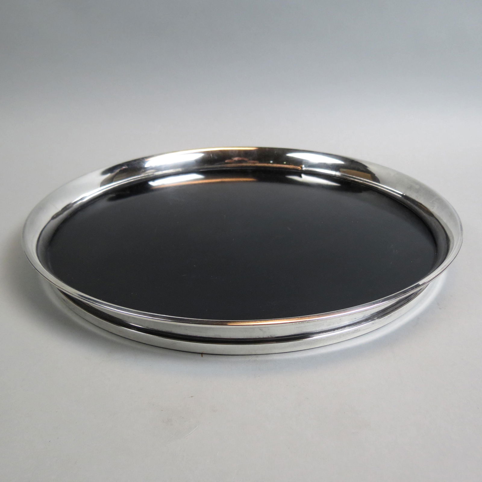 Gorham Sterling Silver & Black Lucite Tray,: mid-century Modern design, by Donald Colflesh, 16" diameter.