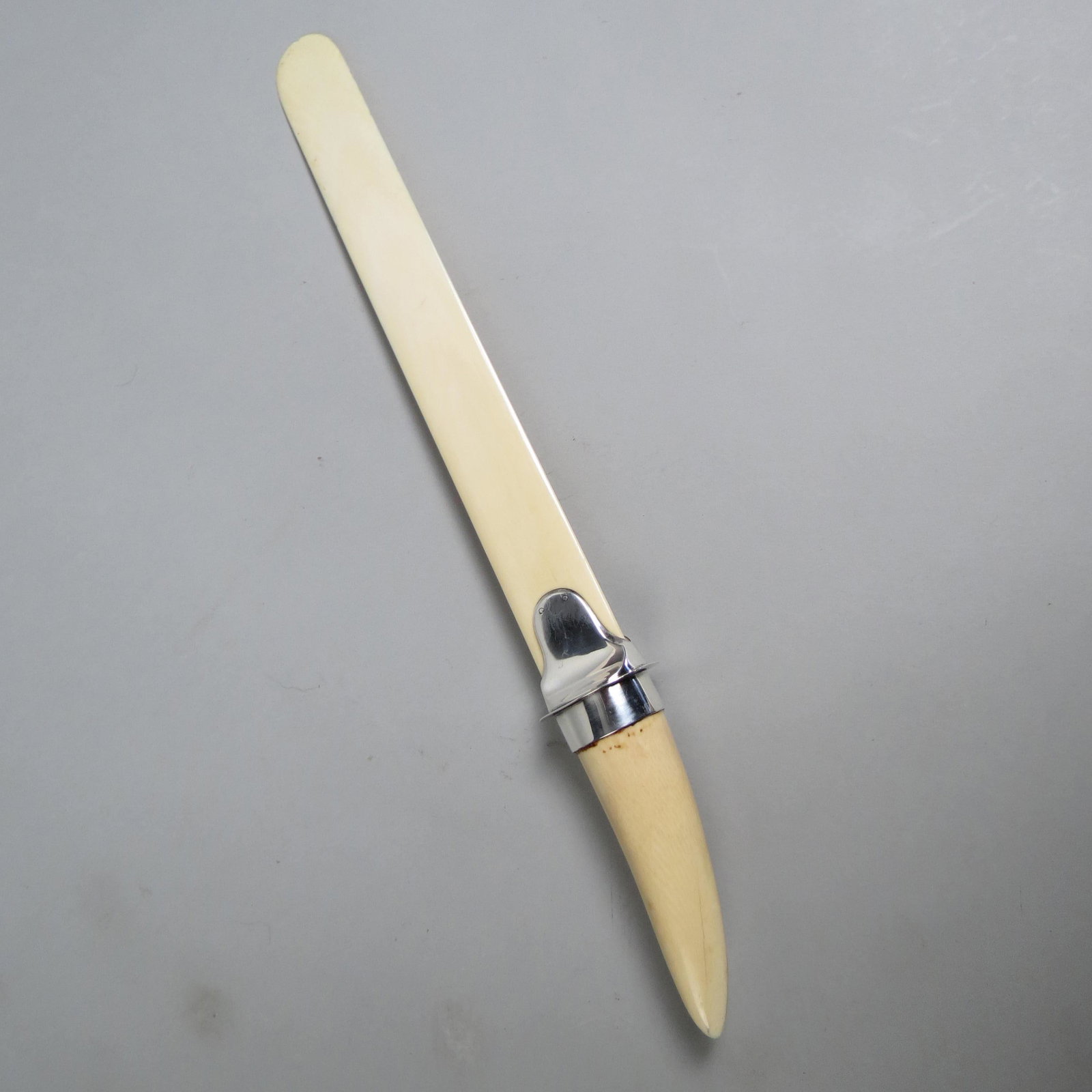 English Victorian Sterling & Tusk Page Turner,: hallmarks, engraved crest, 17 1/2".
