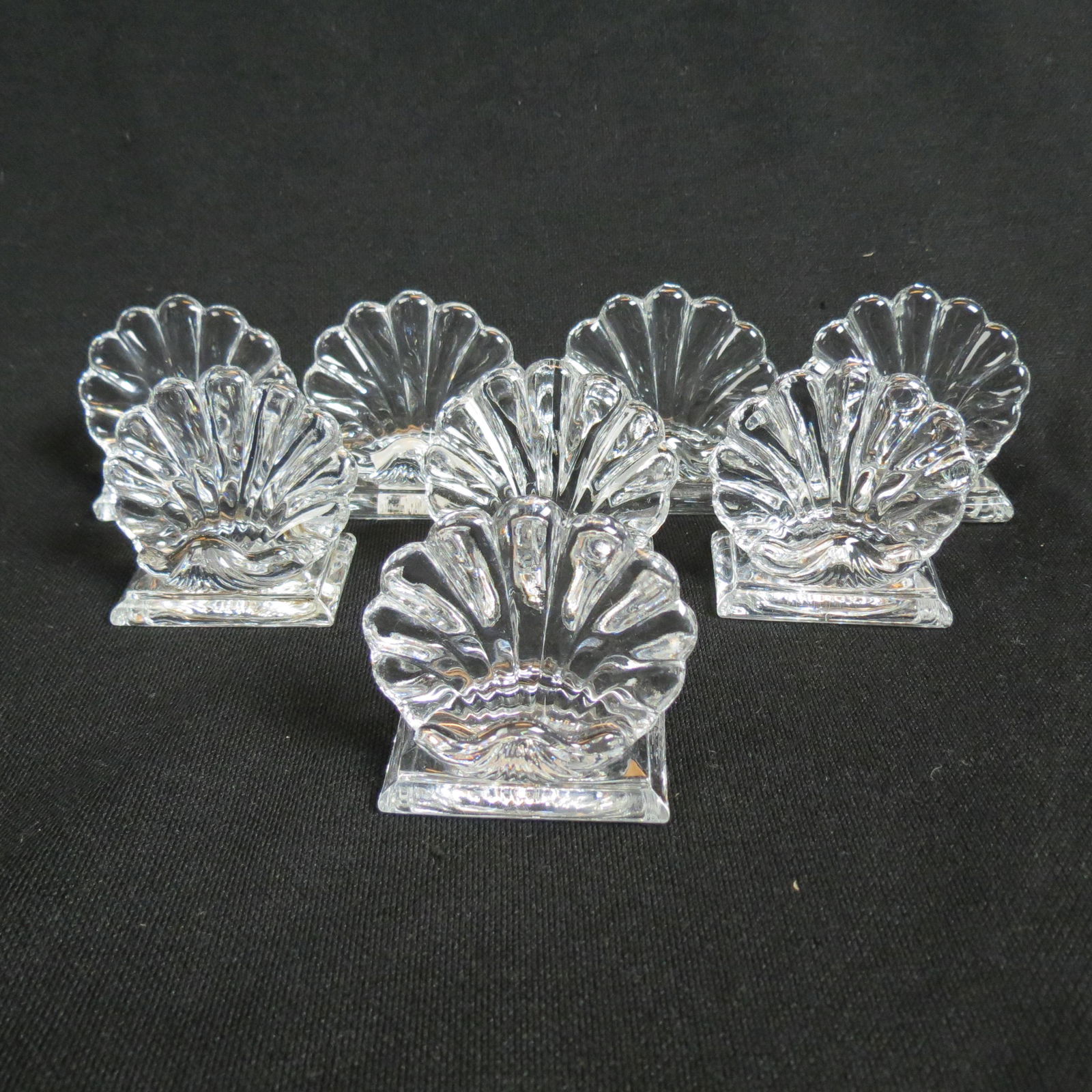 8 Baccarat Crystal "Shell" Place Card Holders,: scallop shape, 2 1/2", signed, excellent......The term crystal, as applied to glass, dates back to the early 1300s in Murano Italy. Glass cutters there developed intricate glass cutting techniques whi