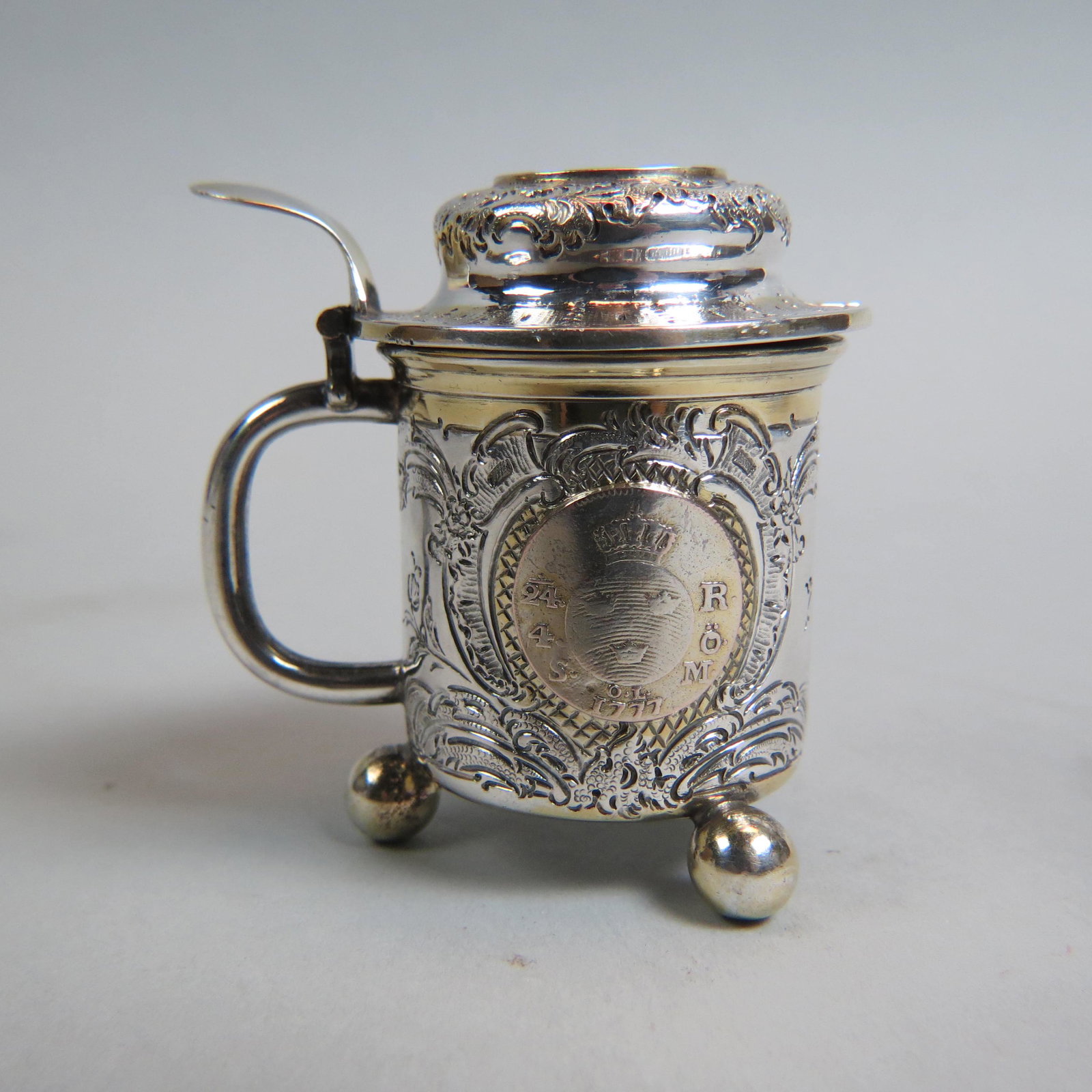 Scandinavian Silver Mustard Pot with Inset Coins,: dated 1777 and 1778, ball feet, gold trim, 2 5/8", hallmarked and signed Mollenborg, excellent.