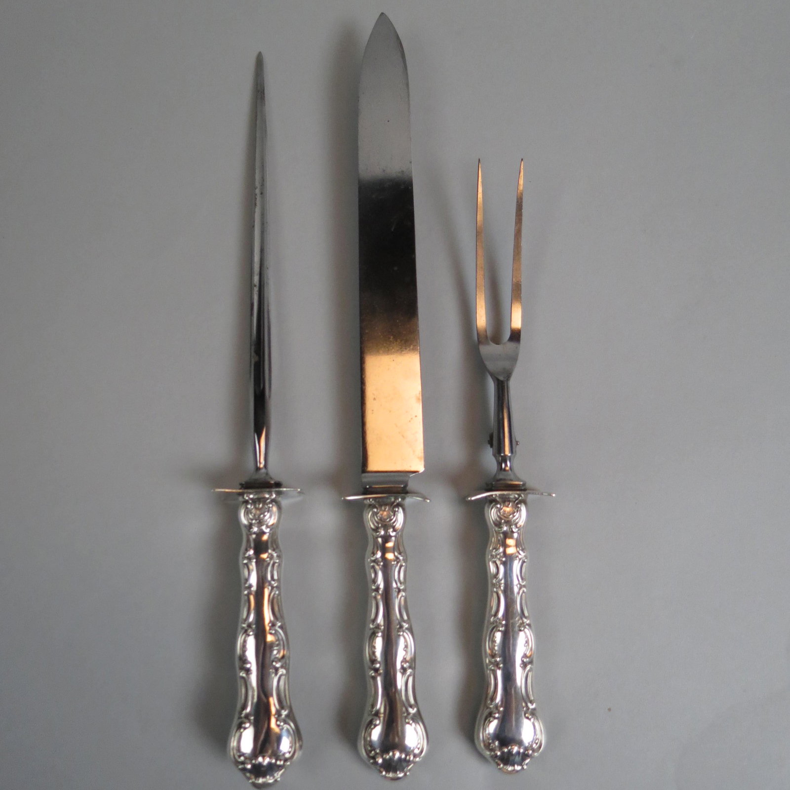3 pc. Gorham Sterling "Strasbourg" Carving Set,: in scarcer roast size, 14" knife, fork and sharpener, monogram "McD", 1893 pattern.