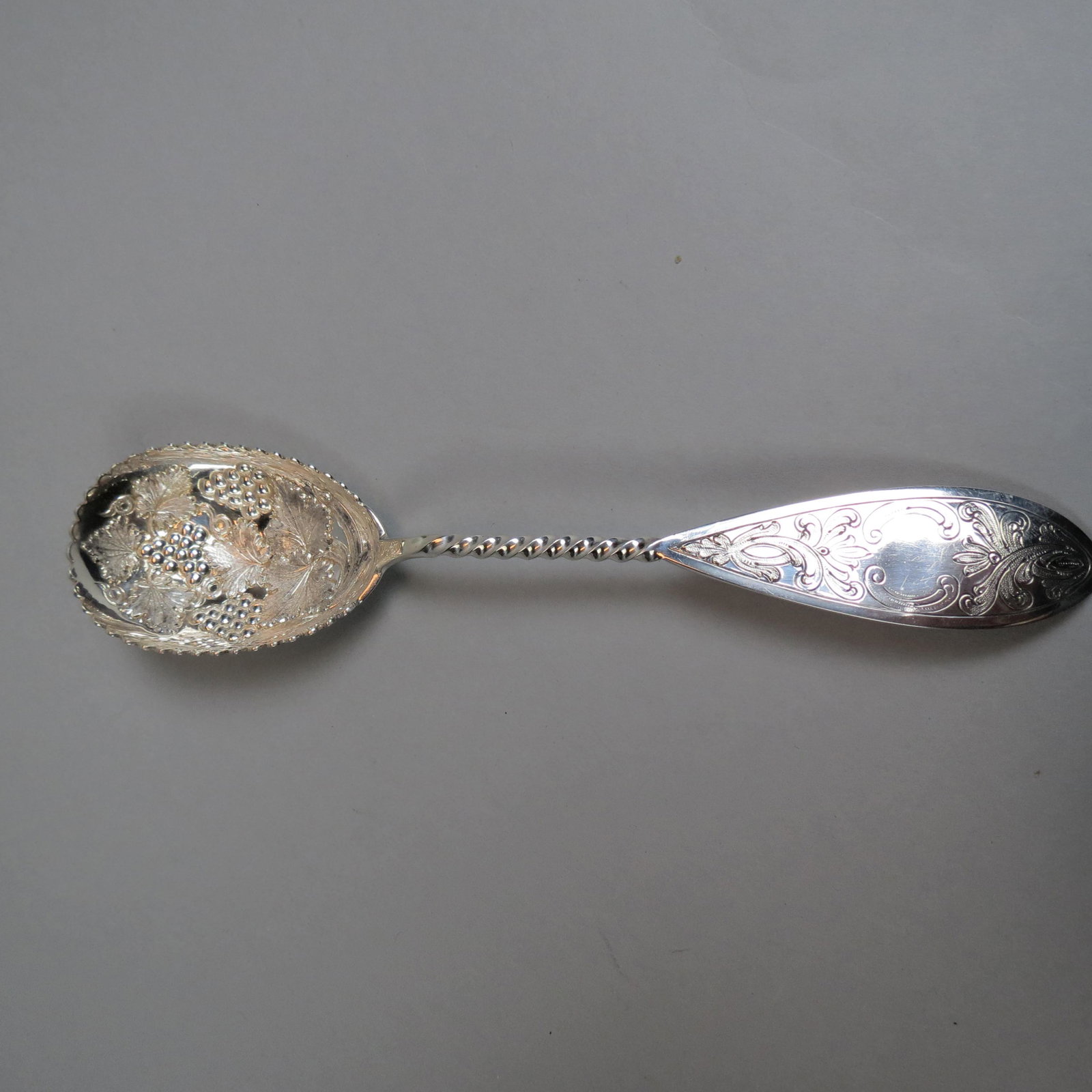 Early American Coin Silver Berry Spoon by Sharp: For Bailey & Company, Philadelphia, PA, twist handle, grape and vine scalloped bowl, 9", 62 grams, no monogram, excellent.