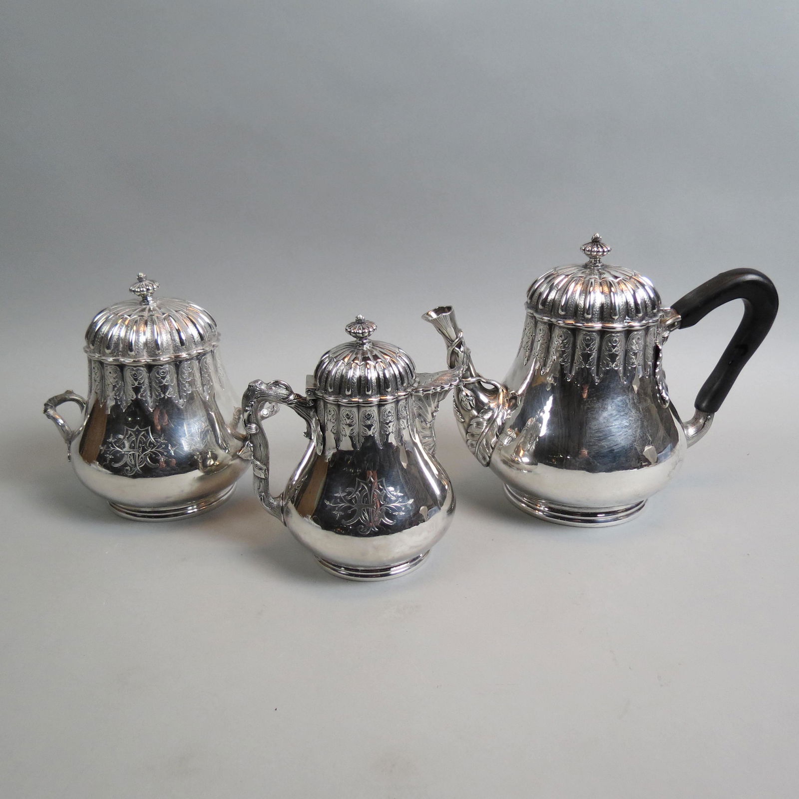 Early Tiffany Sterling 3 pc. Tea Set,: ribbed and engraved designs, leaf and vine handles, 550 Broadway mark, 8 1/2" teapot, 6 1/2" creamer and 7" sugar, fancy monogram, 2213 grams, made for Tiffany by Grosjean and Woodward......Woodward &