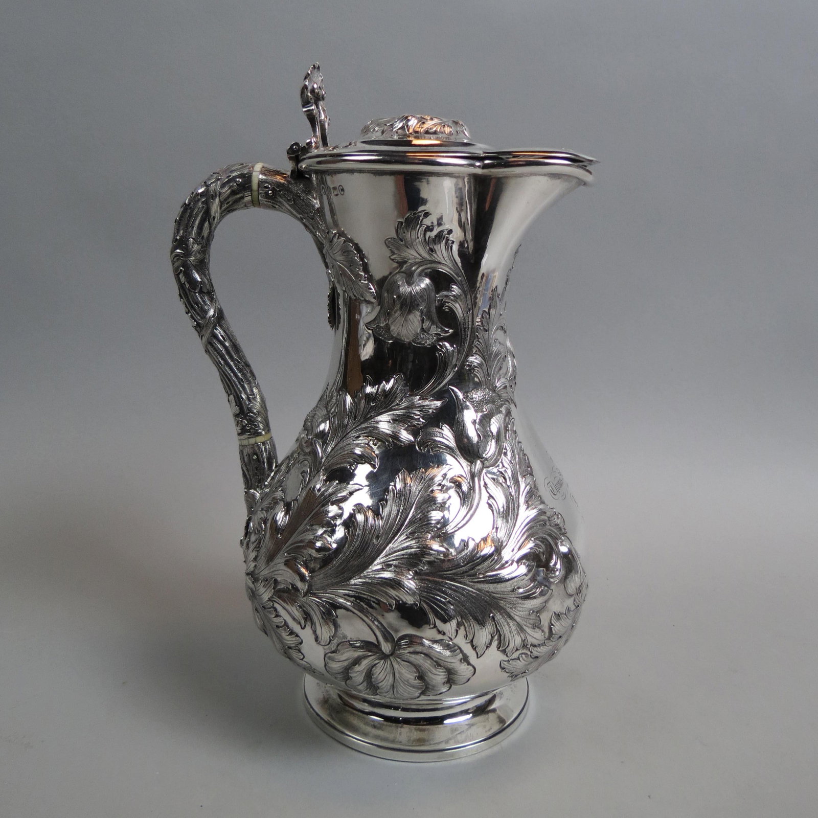 1859 Scottish Sterling Pitcher or Jug,: elaborate raised thistle & leaf design, hinged top, 11 1/2" tall, 1025 grams, hallmarked, maker J. McKay, Edinburgh, presentation monogram and date of 1860, scarce.