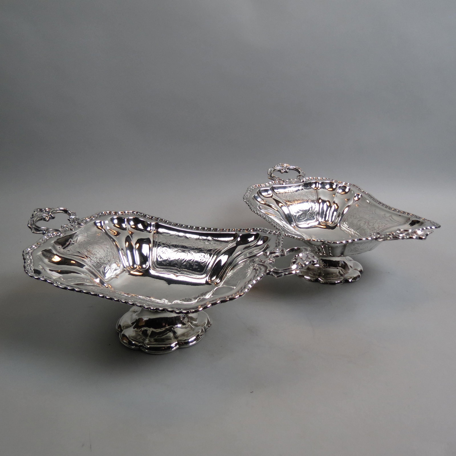 Pair of Silverplate Fruit Compotes,: engraved designs, 10" x 12" plus handles, low pedestal base, circa 1880, excellent.