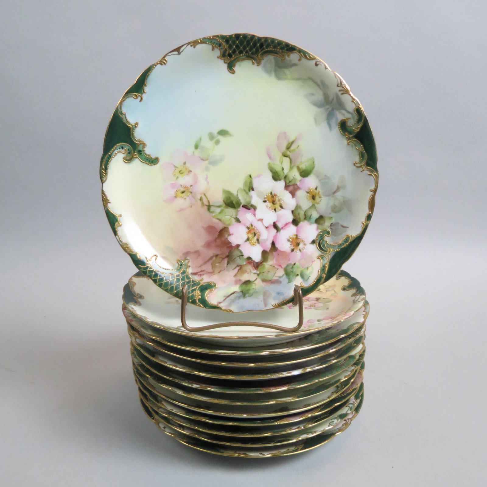 12 J.P. Limoges Hand Painted Porcelain Plates,: various floral designs, gold trim, 8 1/2", 11 are excellent, one has rim chip.