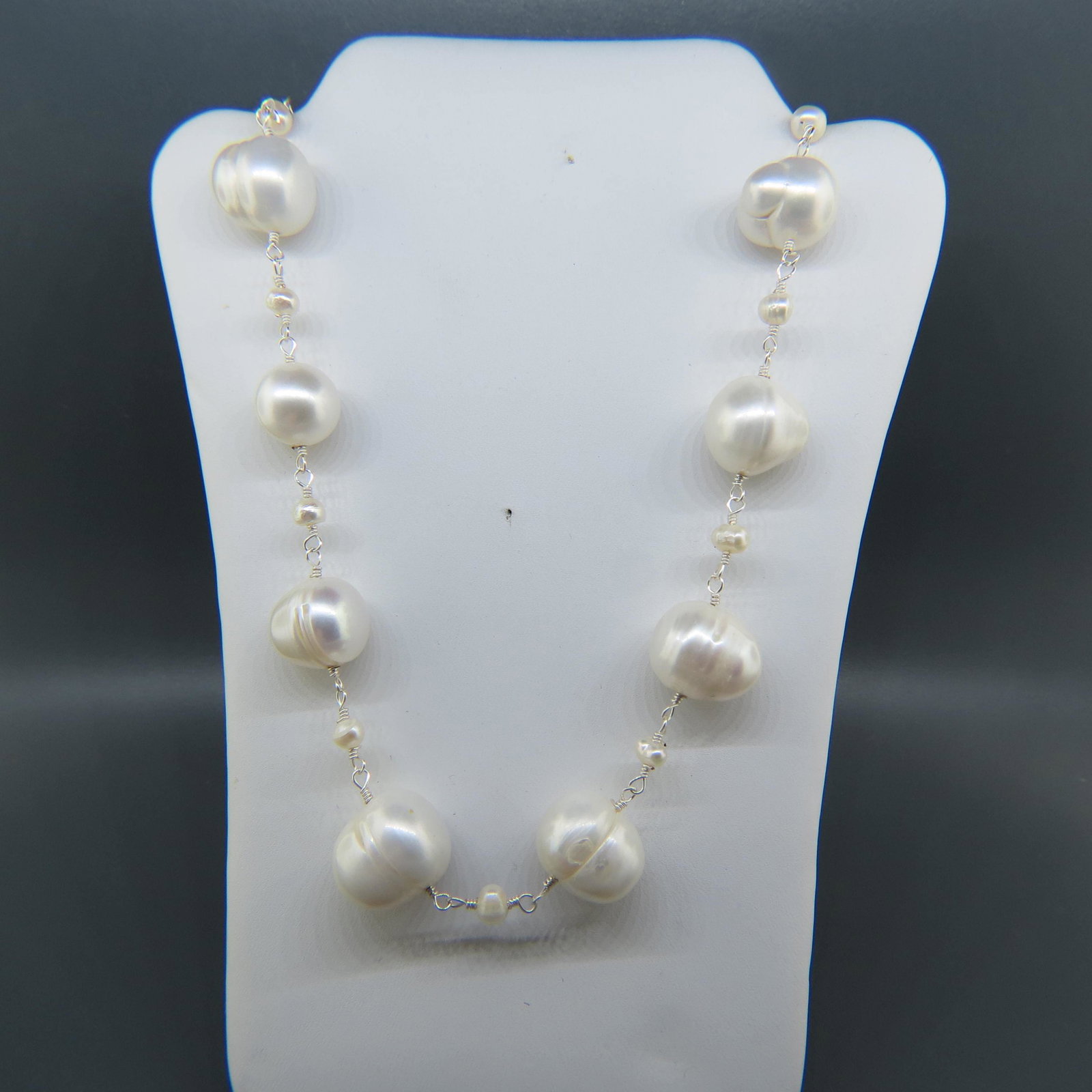 Pearl & Sterling Necklace,: 13 pearls 12 to 13mm and 18 smaller pearls on sterling wire, 19" long.