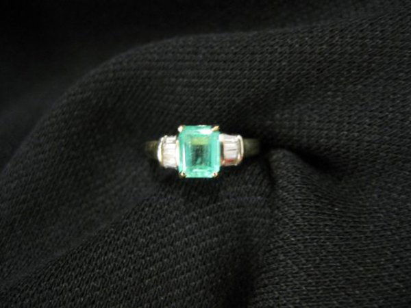Emerald & Diamond Ring, 1.51 carat emerald cut gem: 1.51 carat emerald cut gem with baguette diamonds in each side totaling .40 carat in 14k yellow gold, with appraisal of $2500.00