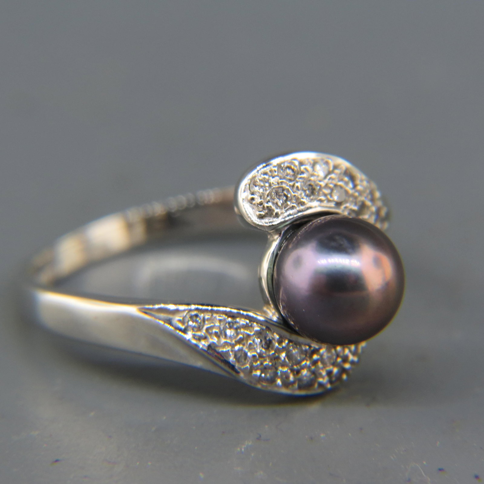 Black Pearl & Diamond Ring,: rich silver black 7mm pearl and 20 small round diamonds in 14K white gold, 3.4 grams, currently size 7.