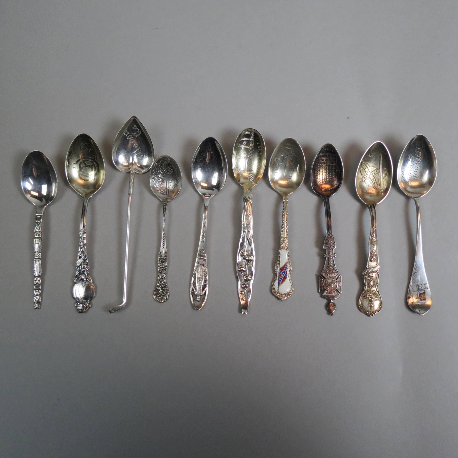 10 Antique Souvenir Spoons Including Golf,: enameled donkey, Masonic, Hawaii, totem pole and more, most 4", 87 grams.