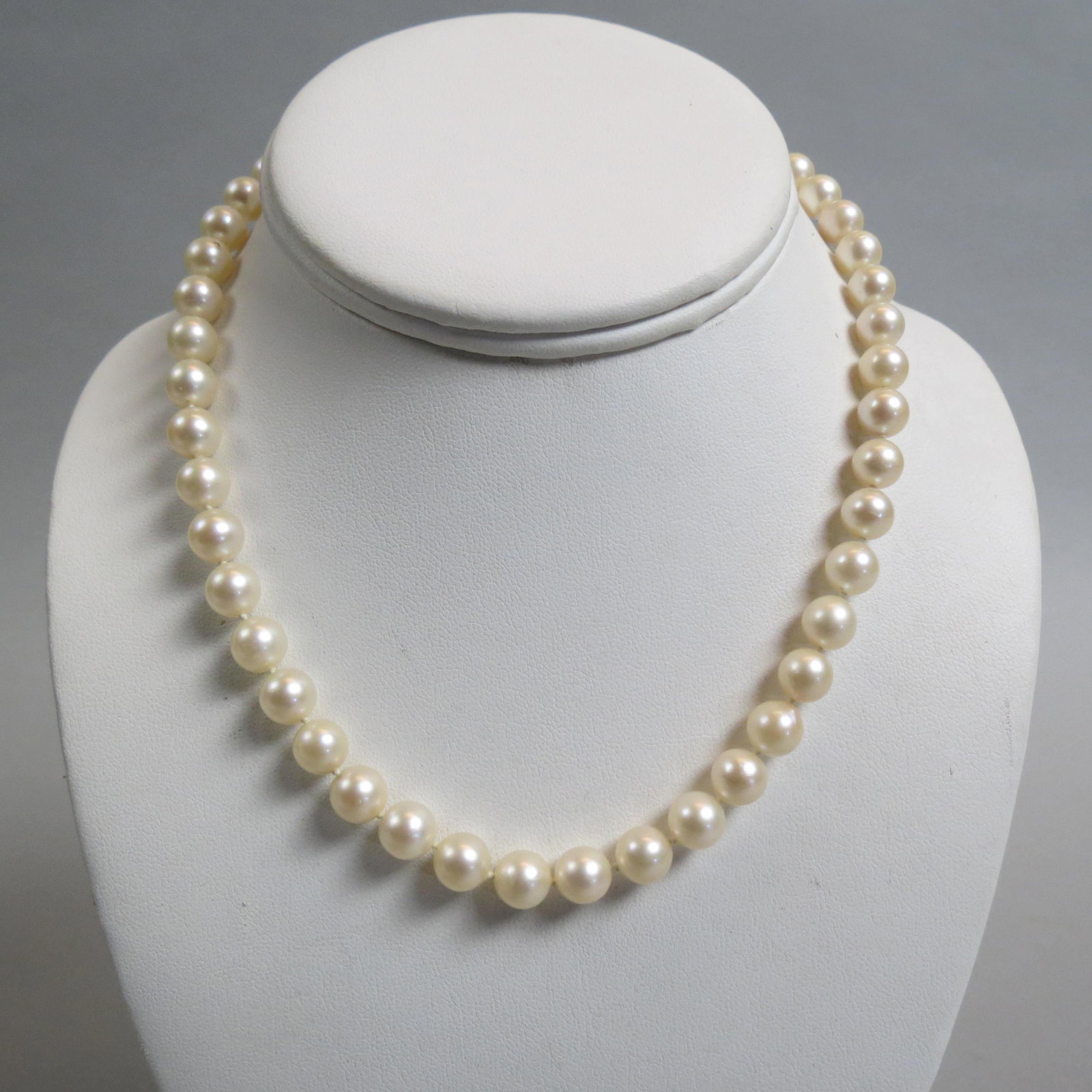 Pearl Necklace,: 46 cream rose pearls measuring 7.5 to 8 mm, sterling clasp, with appraisal of $600.00, 15" long.