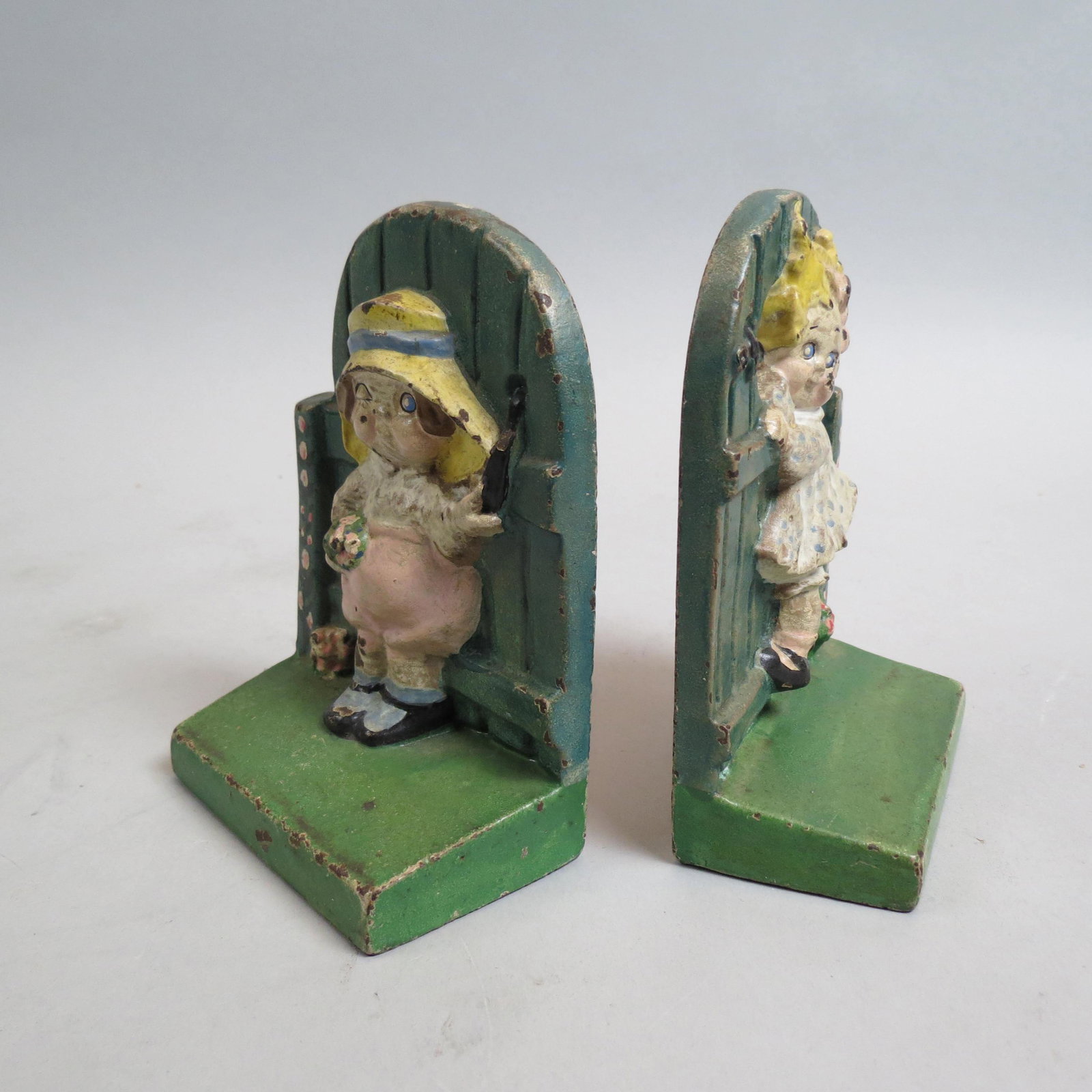 Pair of Cast Iron Dolly Dingle Bookends,: original paint, 5 1/2", signed G.G.D.