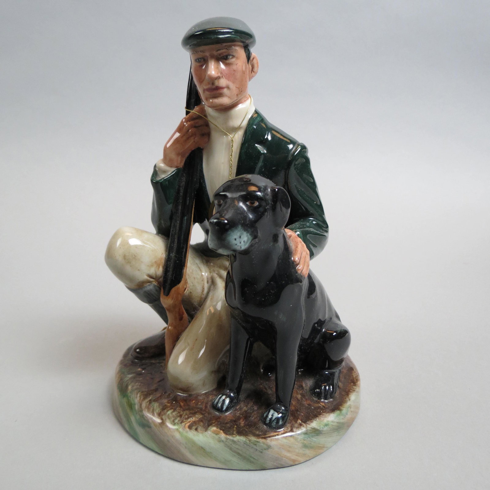 Royal Doulton Figurine "The Gamekeeper",: HN-2879, designed by E.J. Griffiths, 1984, 7 1/4", excellent.