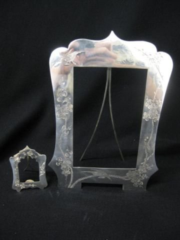 Pair of Chinese Export Sterling Picture Frames, en: engraved bird & florals, one would hold a 4" x 5 1/2" image, other a 1 1/4" x1 1/2" image, circa 1920's.