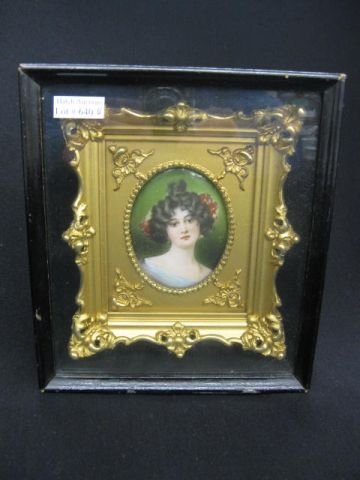 Miniature Painting on Porcelain of Young Lady, : oval 2 1/2" x 3" image area, in elaborate gold gilt frame that has been protected under glass, circa 1880.