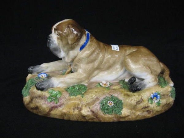 Meissen Porcelain Figurine of a Dog at Rest,: naturalistic base, applied foliage, some petal loss otherwise fine, 19th century crossed swords mark, 5" tall, 10" long.