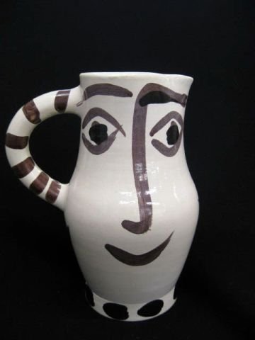 Picasso Art Pottery Pitcher with smiling face,: #69 of 300, Madoura edition, 9" tall, excellent. This is the foreword from the "Picasso's edited ceramic works" catalogue by Alain Ramié. It was on the 21st July 1946 that Picasso, sojourning at the 