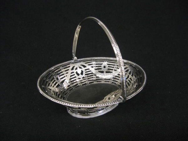 1779 Hester Bateman English Sterling Basket,: garland & urn design with fine openwork, swing handle, oval, 5" x 6", hallmarked, excellent.