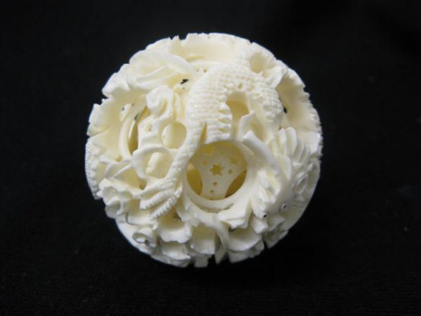 Carved Ivory "Mystery Ball" with approx. 7 : inner carved balls, elaborate dragon decor, 2" diameter, excellent.