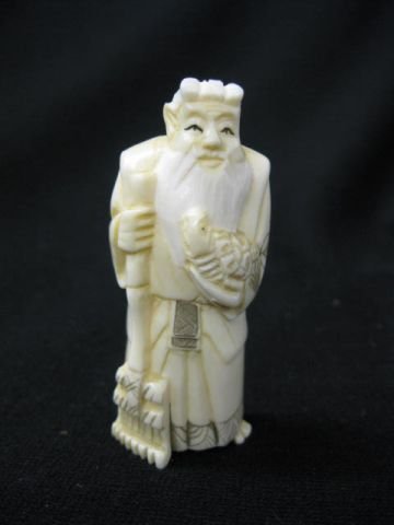 Carved Ivory Figurine of a Scholar, 