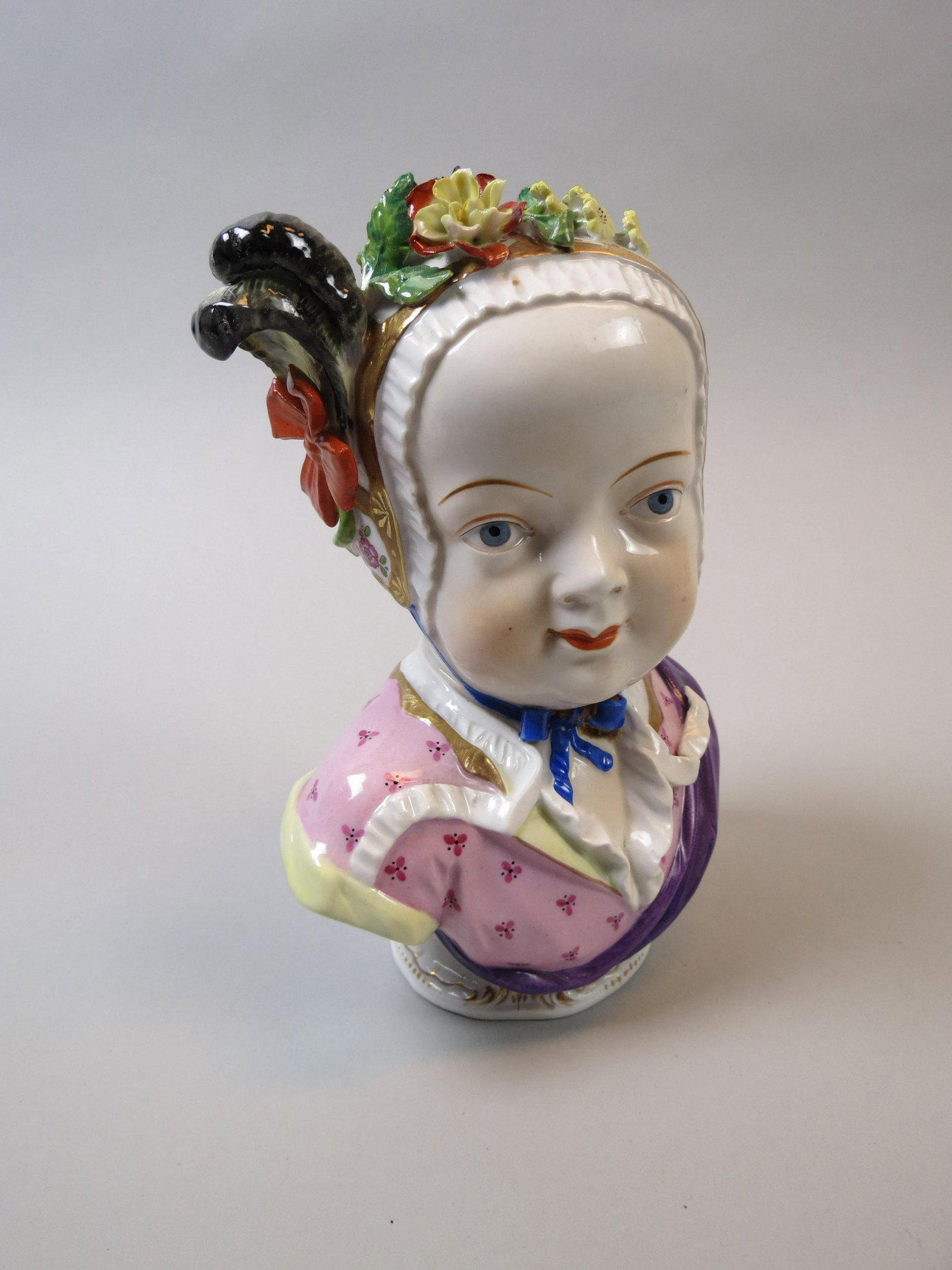 Dresden Porcelain Bust of a Young Girl: Handpainted, applied flowers on bonnet, 7 1/2" tall, excellent.