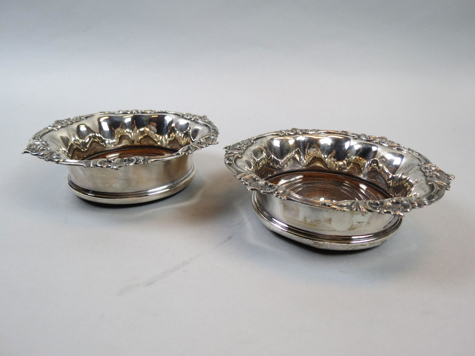 Pair of English Silverplate Wine Coasters,: wood lined, 7" diameter.