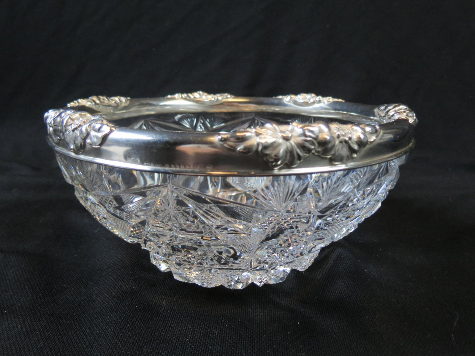 Brilliant Period Cut Glass & Sterling Bowl: Art Nouveau sterling floral rim by Gorham, fine cut work on tiered body, 8" diameter.