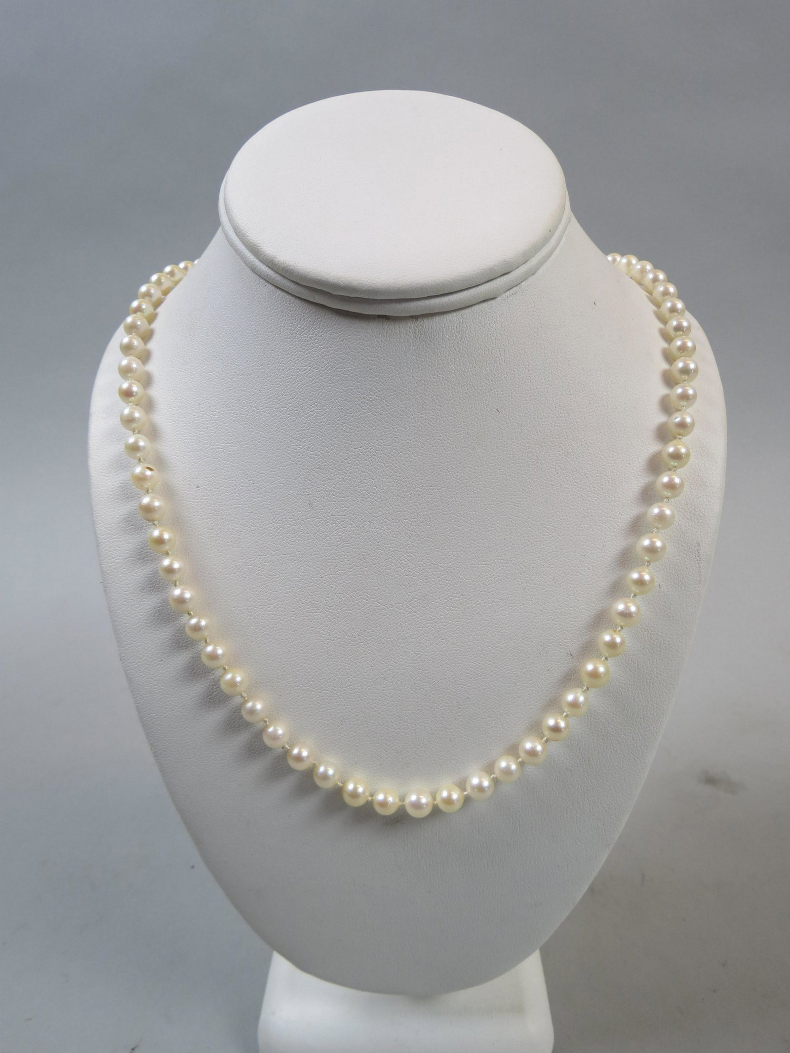 Pearl Necklace: 84 Pearls measuring 6 to 6.5 Mm, 14K white gold clasp, 26" long.