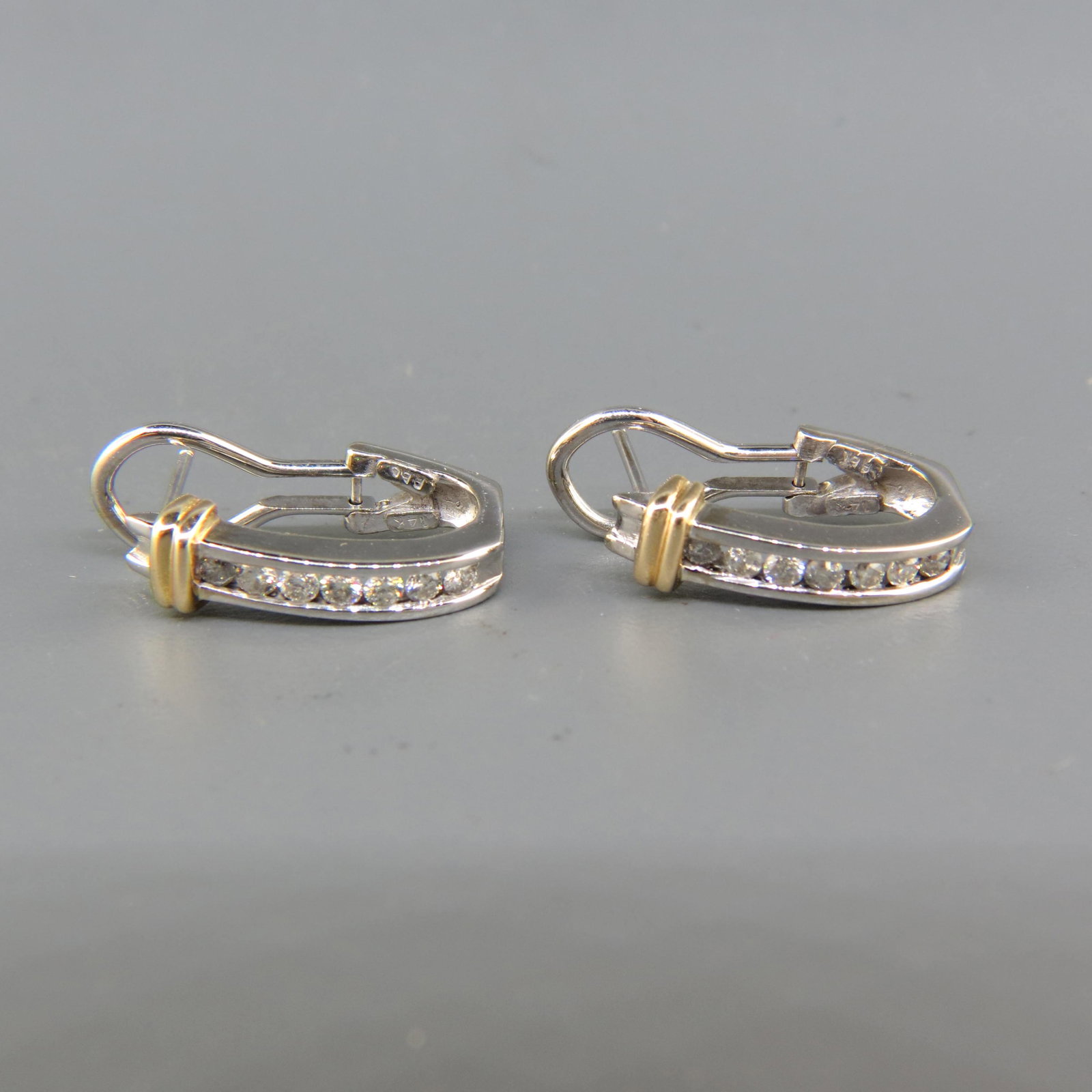 Diamond 14K Gold Earrings: 14 Round diamonds totaling .50 Carat in 14K white and yellow gold, huggie style, with appraisal of $1,650.00, 3/4" Long.