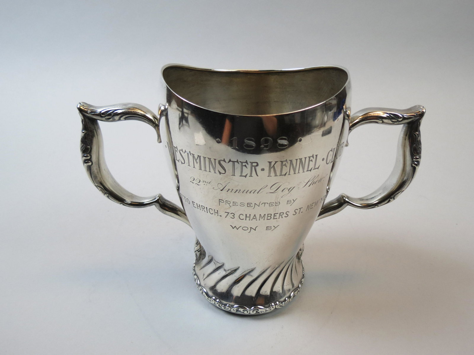 Whiting Sterling 1898 Famous Dog Trophy: 1898 Westminster Kennel Club, 22nd annual dog show, handled, 6" tall, 8" handle end to handle end, 1 1/2 pints, Art Nouveau style, 319 grams............In 1877, New York was well on its way to becomin
