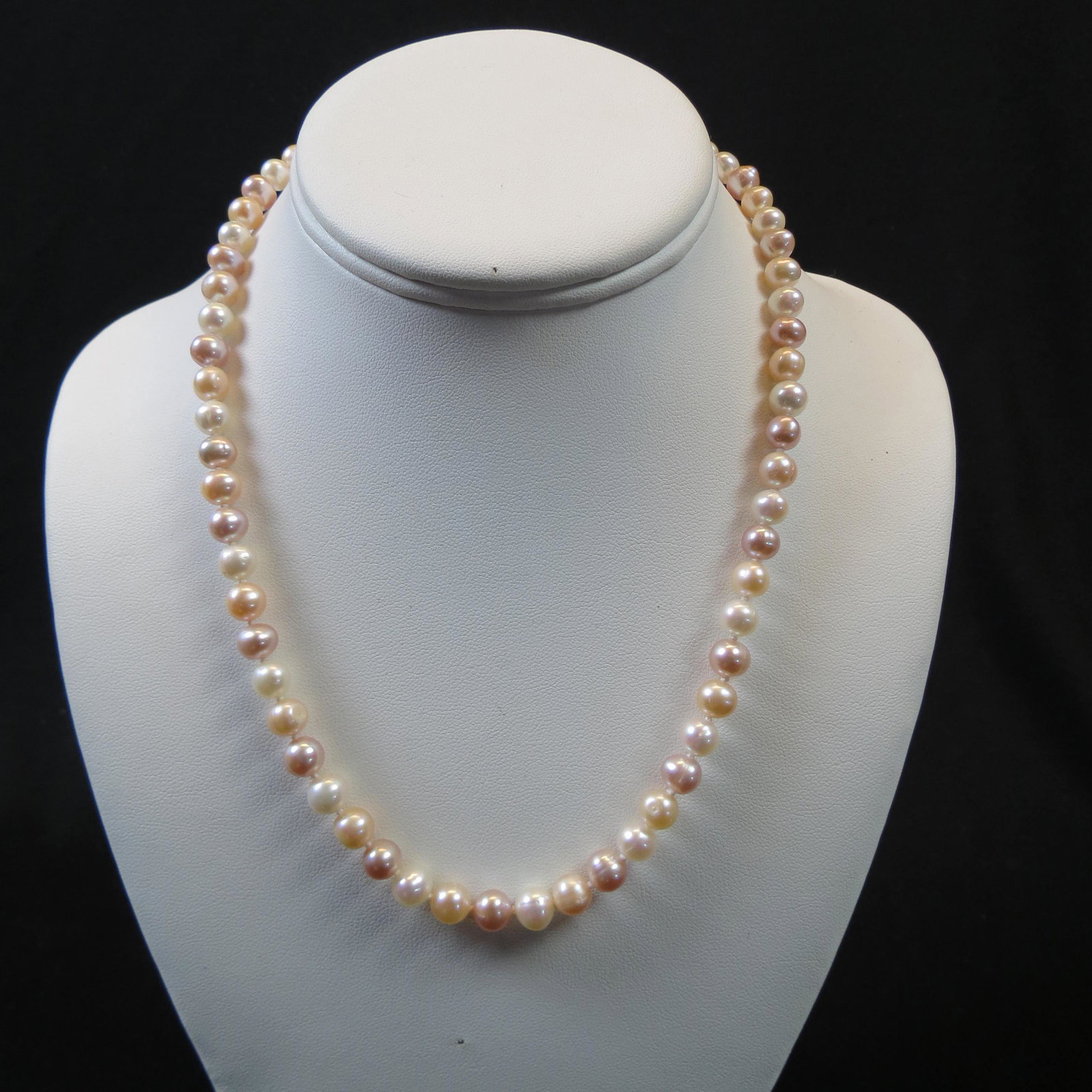 Pearl Necklace: 62 Alternating light golden, silver gray and white pearls, 7 to 7.5 Mm, 19" long.
