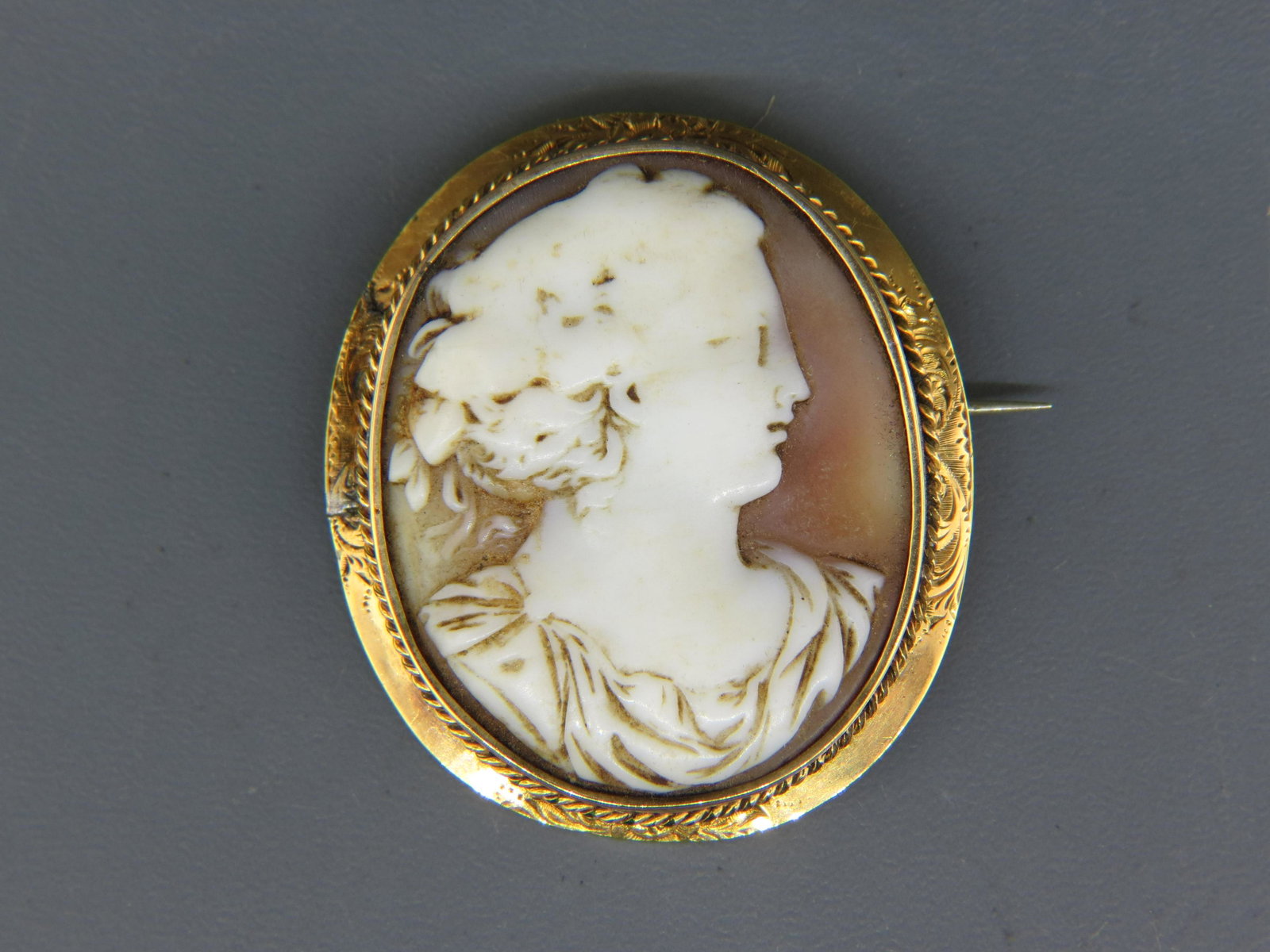 Victorian Gold Framed Cameo Brooch: Carved shell portrait of a lady, oval, 1 7/8" X 1 1/2", much old lead soldier repair to back.