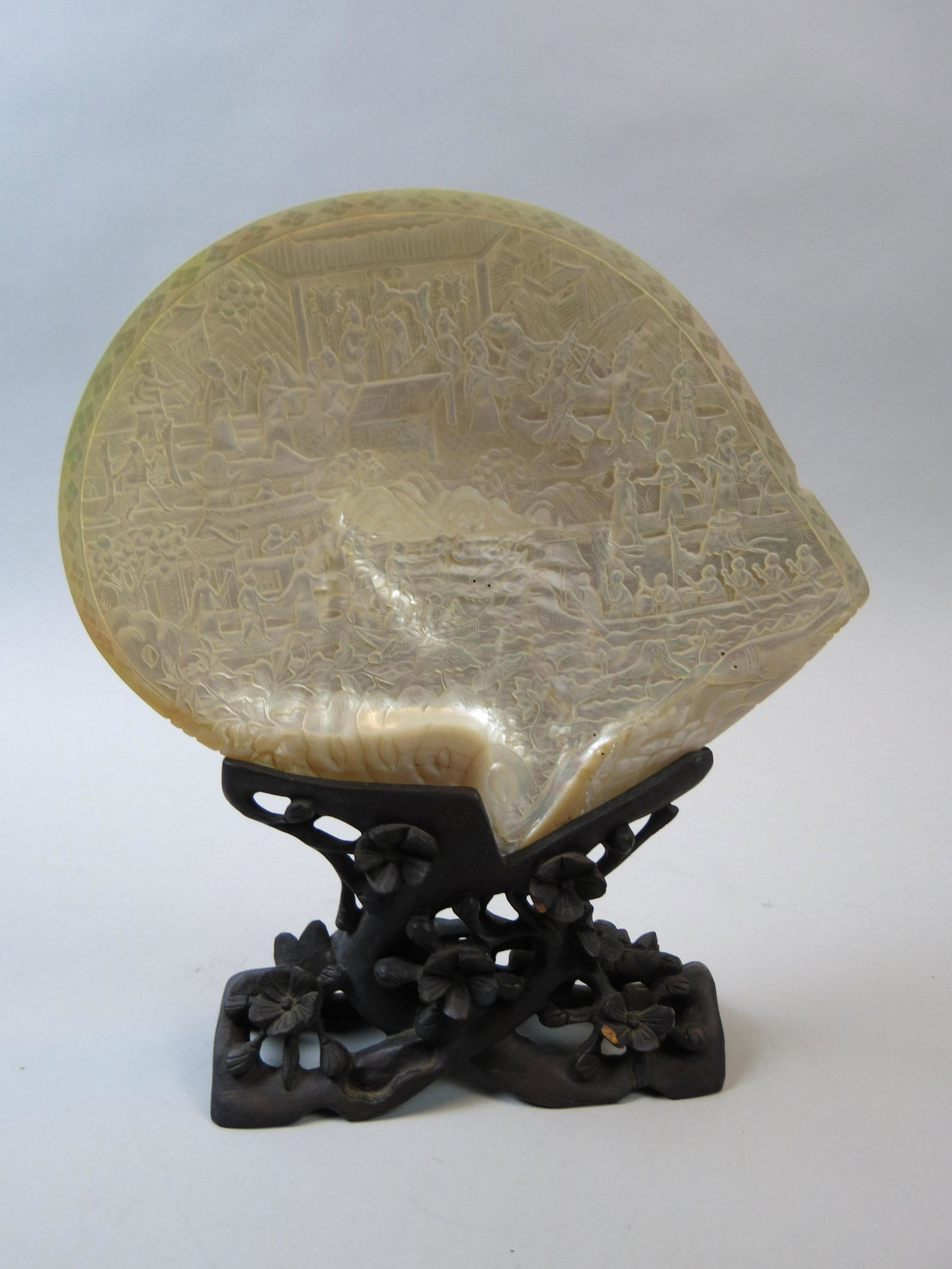 Chinese Carved Mother-of-Pearl Shell Table Screen,: Scenes with landscapes and villagers, 8 1/2" x 10", plus carved wooden holder.