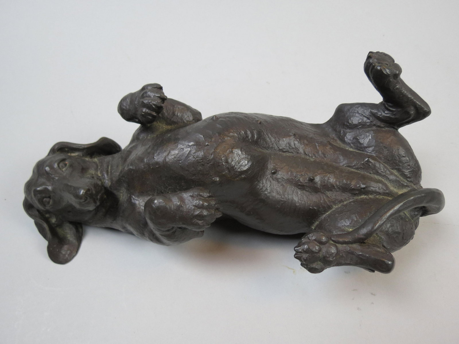 Bronzed Figurine of a Dachshund: Bronzed Figurine of a Dachshund, by Doris Linder, England, adorable dog laying on her back, 11" long, 4 1/4" tall, excellent.