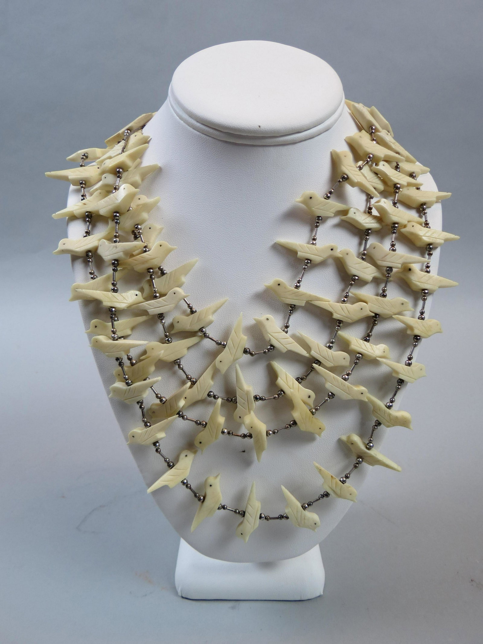 Native American Fetish Necklace with Birds: Native American Fetish Necklace with Birds, carved bone with sterling beads and spacers, four tiers, 26" long plus tiers.