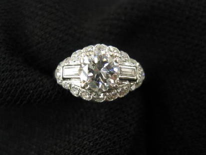 Platinum & Diamond Art Deco Ring,: 1.03 center stone with baguette & round diamonds totaling another .75 carat, all high grade (VS-6) with appraisal of $13,300.00