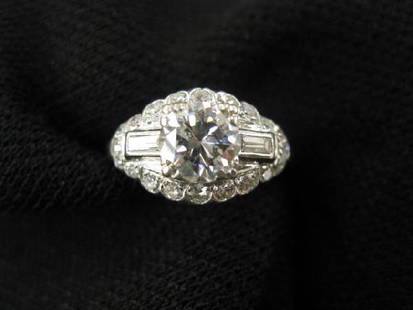 Platinum & Diamond Art Deco Ring,: 1.03 center stone with baguette & round diamonds totaling another .75 carat, all high grade (VS-6) with appraisal of $13,300.00