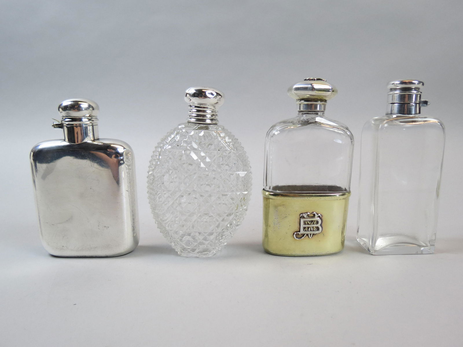4 Sterling & Crystal Flasks,: include cut glass, silver overlay and more, approx. 4 1/2", 3 have English hallmarks.