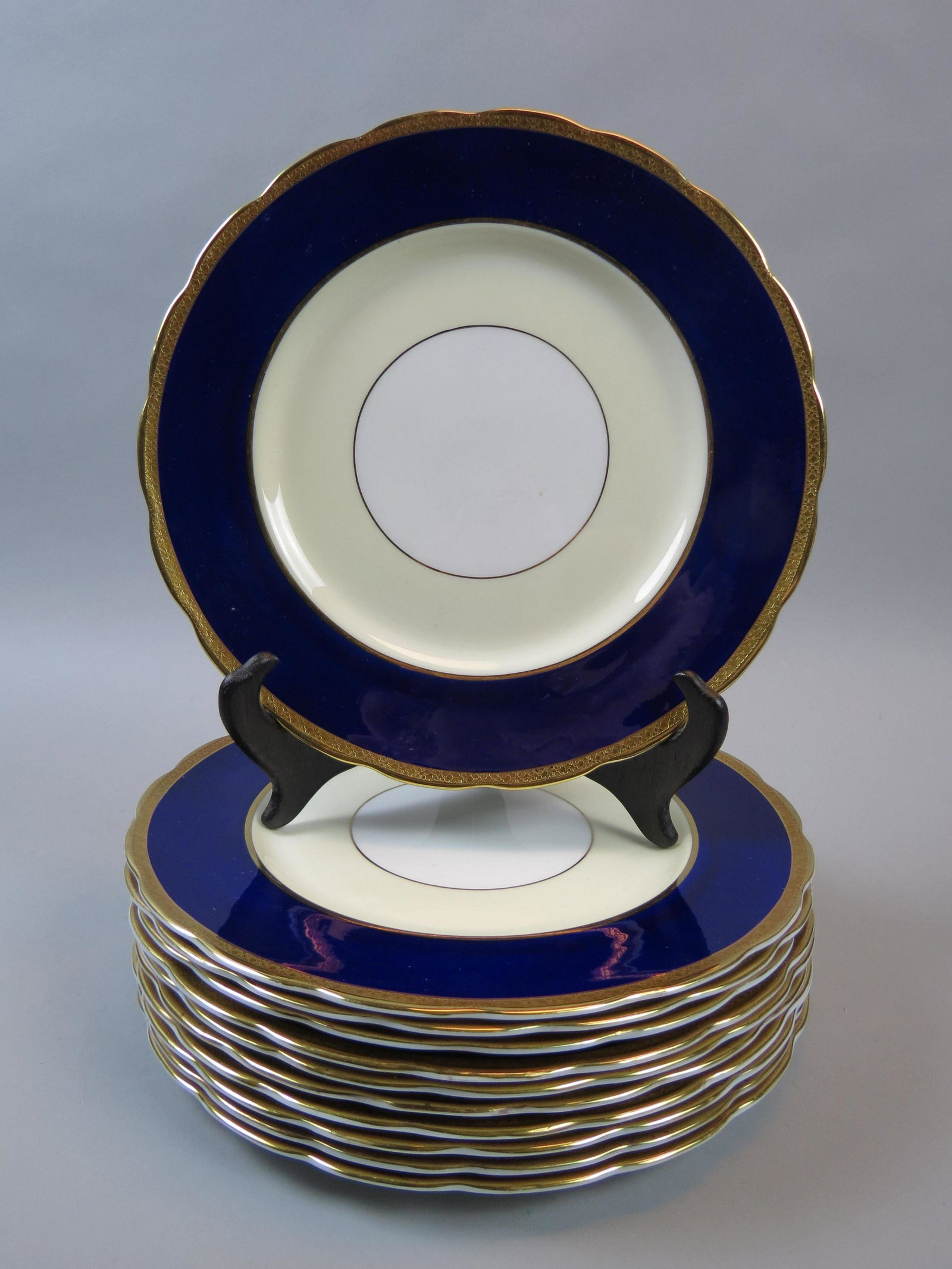 11 Royal Swansea Bone China Plates "Yarborough",: pattern with blue and cream with white center medallion, gold trim, 10 1/2", excellent.