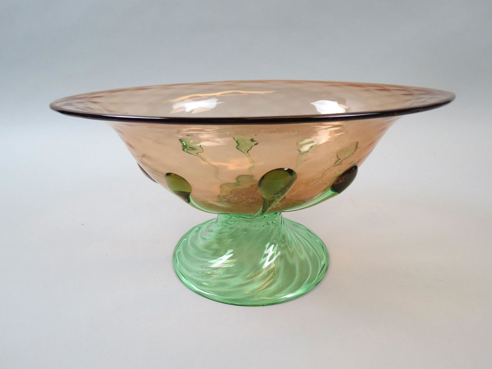 Art Glass Console Bowl,: green prunts applied on pink ovoid body shape, green swirling base, possibly Steuben, 9 1/2" X 12 1/2", 6" tall.