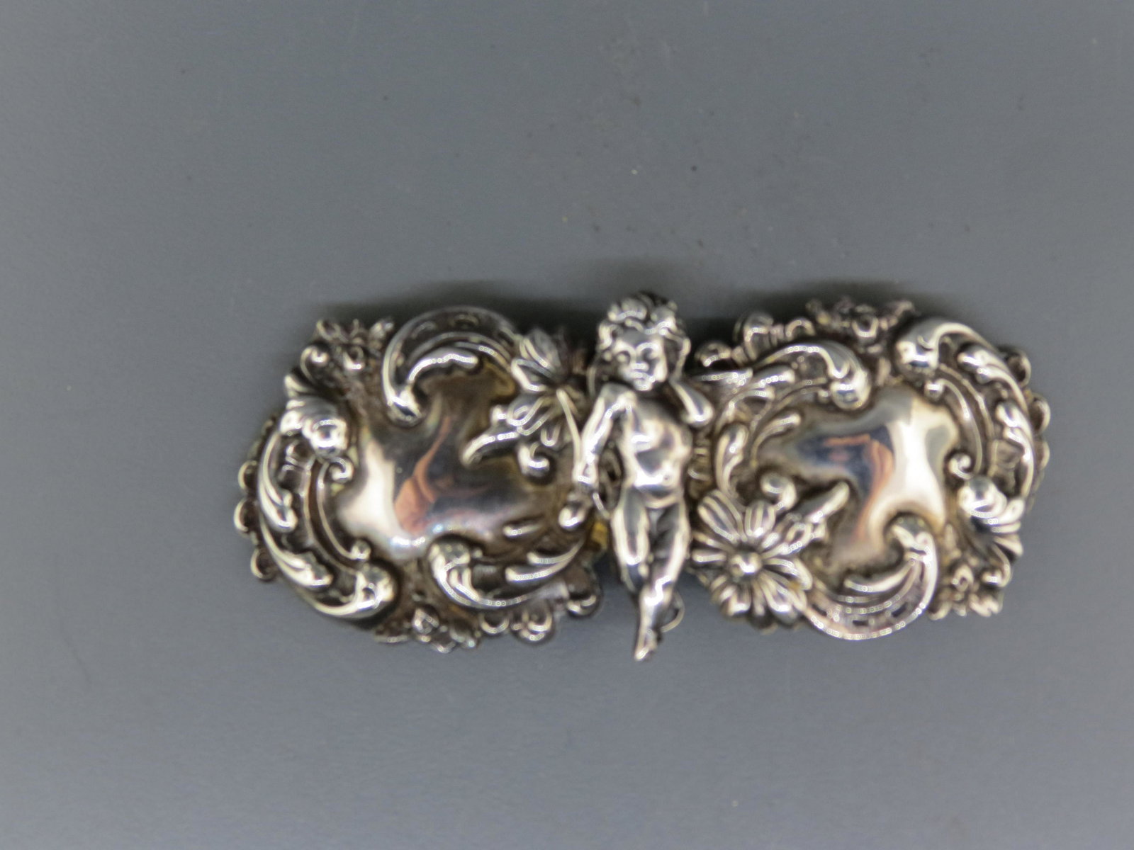Victorian Sterling Silver Art Nouveau Buckle,: cherub abd floral, 1 3/8" X 3 1/2", unsigned.