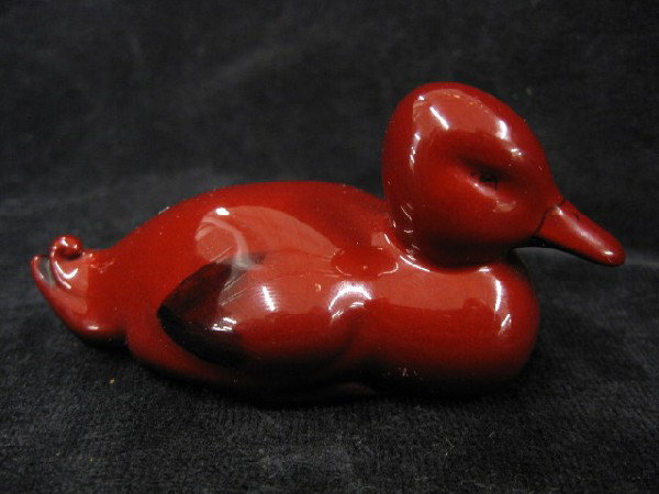 Royal Doulton Rouge Flambe Figurine of a Duck,: seated, 1 1/2" tall, excellent, model #112, excellent.