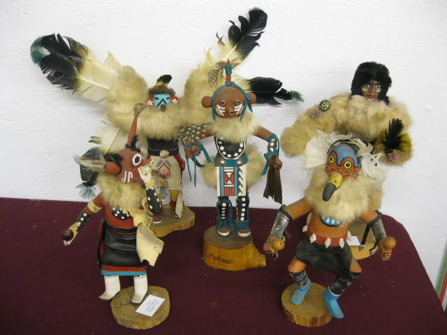 5 Indian Figurines, carved & painted wood with lea: carved & painted wood with leather & feather decoration, 10" to 12".